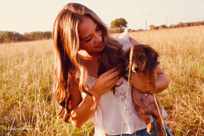 Best friends golden hour portrait session with dog in field