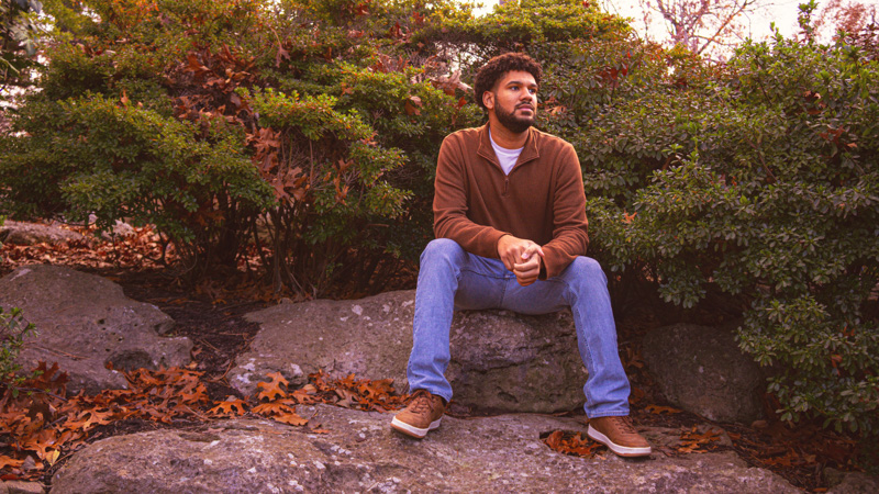 Casual outdoor senior portrait on rock, Oklahoma photographer
